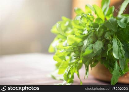 Fresh organic rucola leaves. Fresh organic rucola leaves on a wooden table