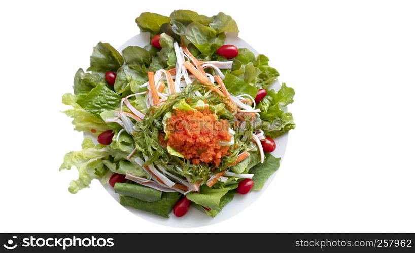 fresh organic salad with fish roe and crab stick on white plate. fresh organic salad