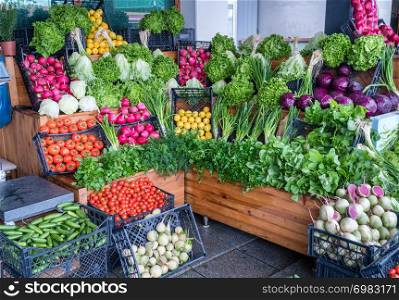 Fresh organic vegetables for sale at greengrocer shop.