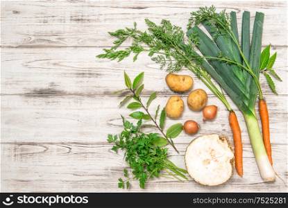 Fresh organic vegetables. Leek, carrots, onion, parsley, potatoes, celery root, bay laurel leaves. Healthy food