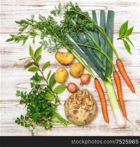 Fresh organic vegetables. Leek, carrots, onion, parsley, potatoes, celery root, bay laurel leaves. Healthy food