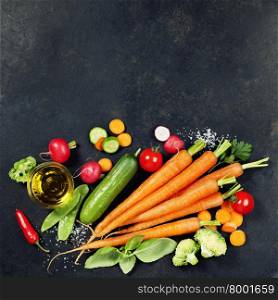 Fresh organic vegetables on dark rustic background. Healthy food. Vegetarian eating. Fresh harvest from the garden. Background layout with free text space.