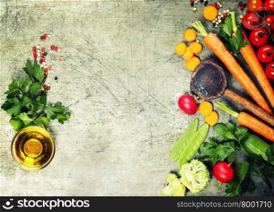 Fresh organic vegetables on rustic background. Healthy food. Vegetarian eating. Fresh harvest from the garden. Background layout with free text space.