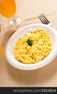 fresh original american style macaroni and cheese with parsley on top ,tipycal american food