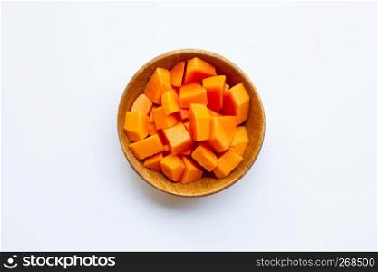 Fresh papaya sliced in wooden bowl on white background.