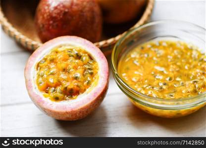 Fresh Passion fruit juice on wooden table passionfruit slice half for smoothie