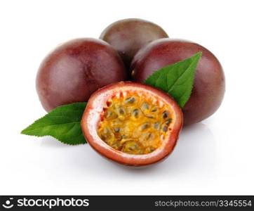 Fresh passion fruit with green leaves isolated on a white background
