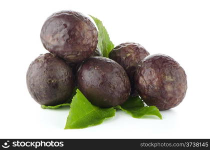 Fresh passion fruit with green leaves isolated on a white background