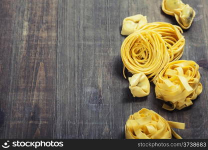 Fresh pasta on wooden table
