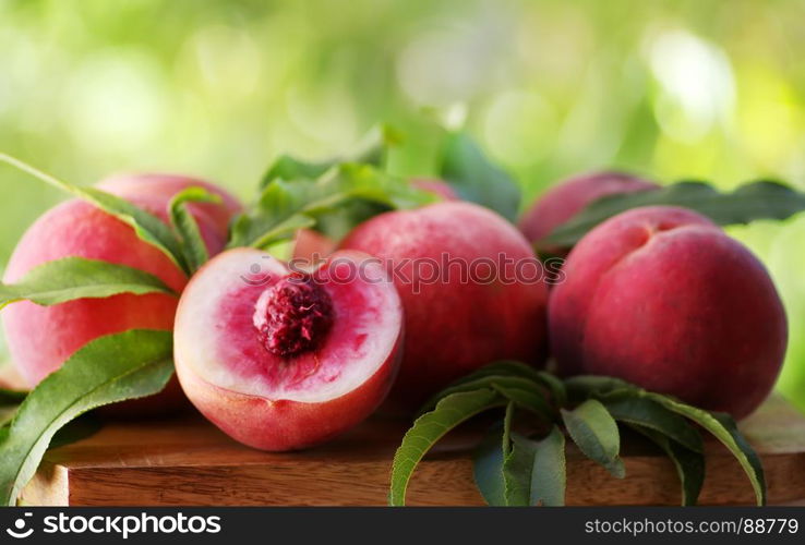 fresh peaches on a wooden table