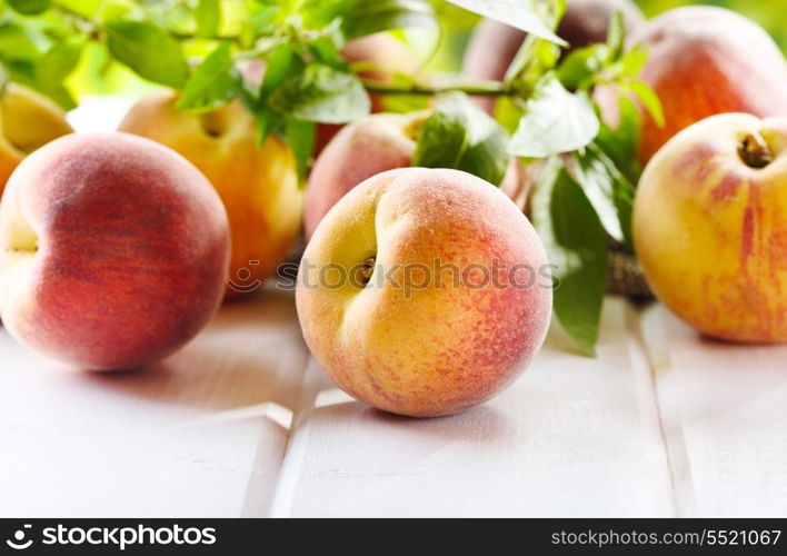 fresh peaches on wooden table