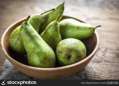 Fresh pears in the rustic bowl