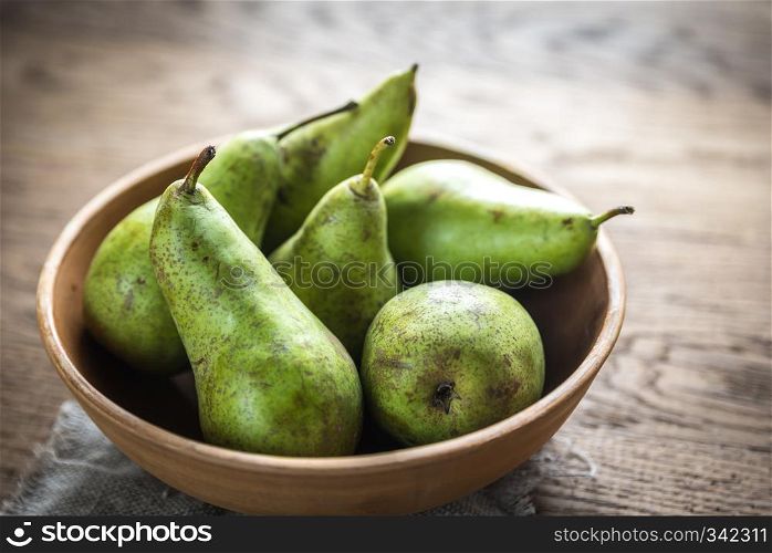 Fresh pears in the rustic bowl
