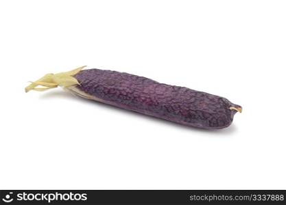 Fresh peas in purple pod on white background