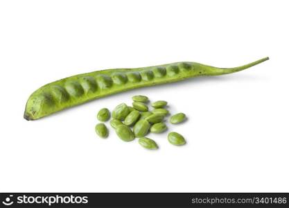 Fresh petai beans and peeled ones on white background