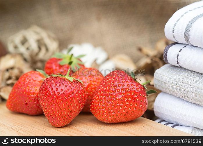 Fresh picked Summer strawberries on rustic wooden background