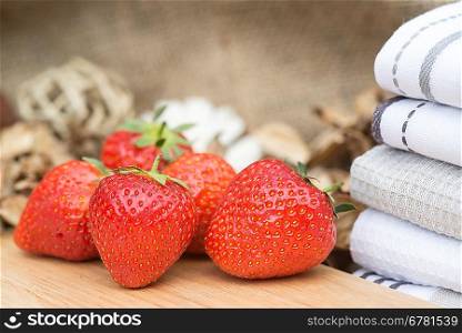 Fresh picked Summer strawberries on rustic wooden background
