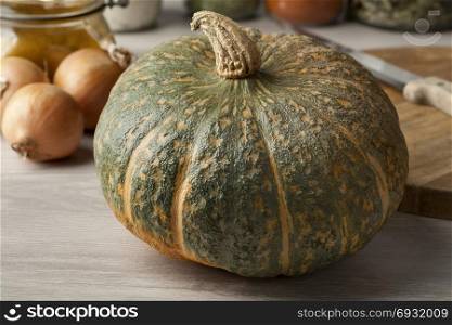 Fresh picked whole pumpkin Courge Delica Moretti in the kitchen