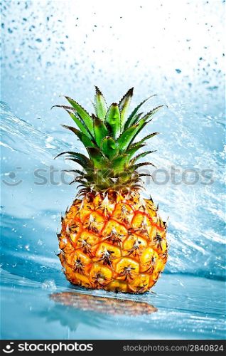 Fresh pineapple in water splashes