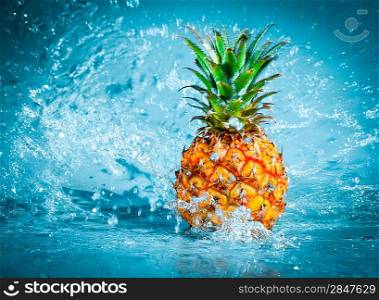 Fresh pineapple in water splashes