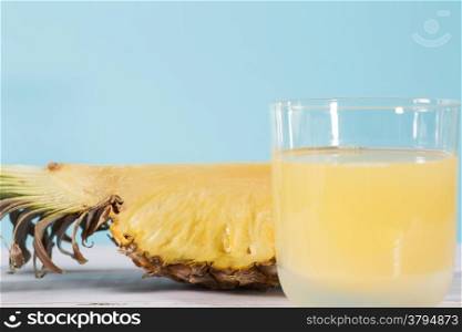 Fresh pineapple juice with blue background