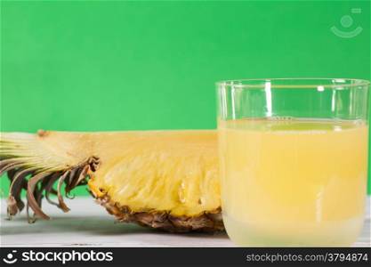 Fresh pineapple juice with green background