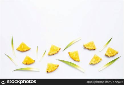 Fresh pineapple slices on white background.
