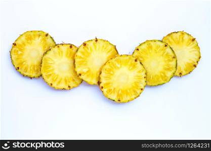 Fresh pineapple slices on white background. Copy space