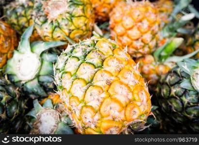 Fresh pineapple summer texture background harvest from pineapple garden tropical fruit for sale in the market