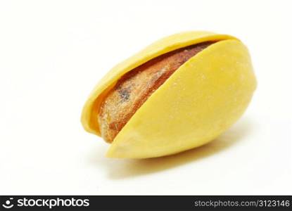 fresh pistachios isolated on a white background