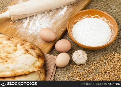 fresh pita bread isolated on sacking background