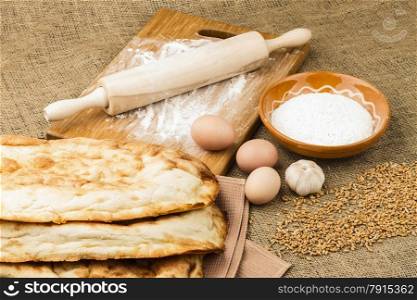 fresh pita bread on sacking background