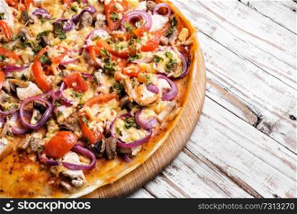 Fresh pizza with meat,tomatoes and mushrooms.Pizza menu.. Tasty appetizing pizza