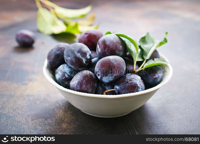 fresh plums on a table, stock photo