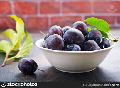 fresh plums on a table, stock photo