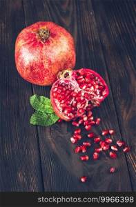 Fresh pomegranate on the wooden table  cross section