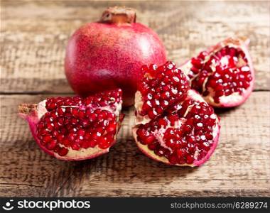fresh pomegranate on wooden table