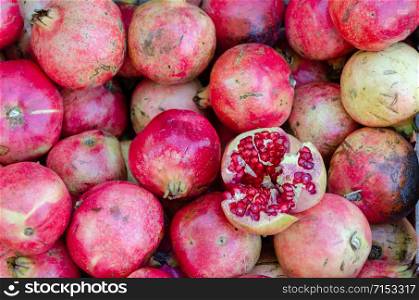 Fresh Pomegranates at the Market. Juicy Pomegranates for Selling on the bench