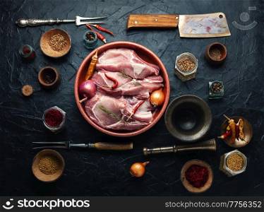 Fresh pork meat for cooking. Pork loin and seasoning. Raw pork loin