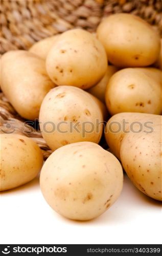 Fresh potatoes in a basket. Fresh potatoes in a basket; white background
