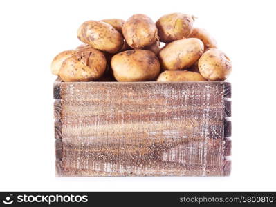 fresh potatoes in wooden box on white background