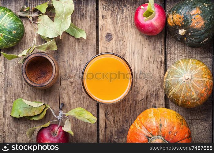 Fresh pumpkin juice.Autumn pumpkin drink.Fresh juice with pumpkins and apples. Fresh pumpkin juice
