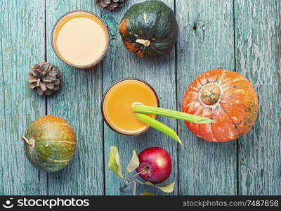 Fresh pumpkin juice.Autumn pumpkin drink.Fresh juice with pumpkins and apples. Fresh pumpkin juice