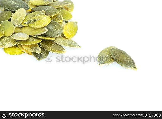 fresh pumpkin seeds isolated on a white
