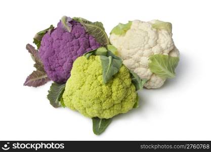 Fresh purple, green and white cauliflower on white background