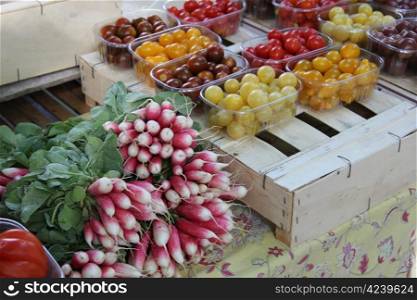 Fresh radish and cherry tomatoes at a market in the Provence, France