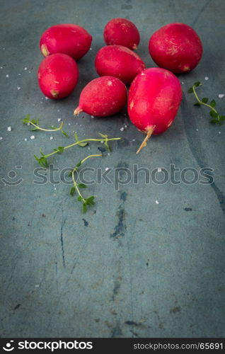 Fresh radishes on vintage background. Healthy vegetable.