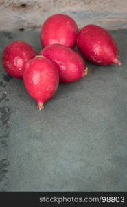 Fresh radishes on vintage background. Healthy vegetable.