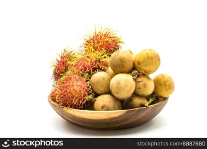 Fresh Rambutans and Longkongs in a wooden bowl on white background