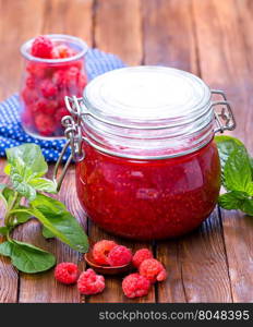 fresh raspberry and jam in glass bank